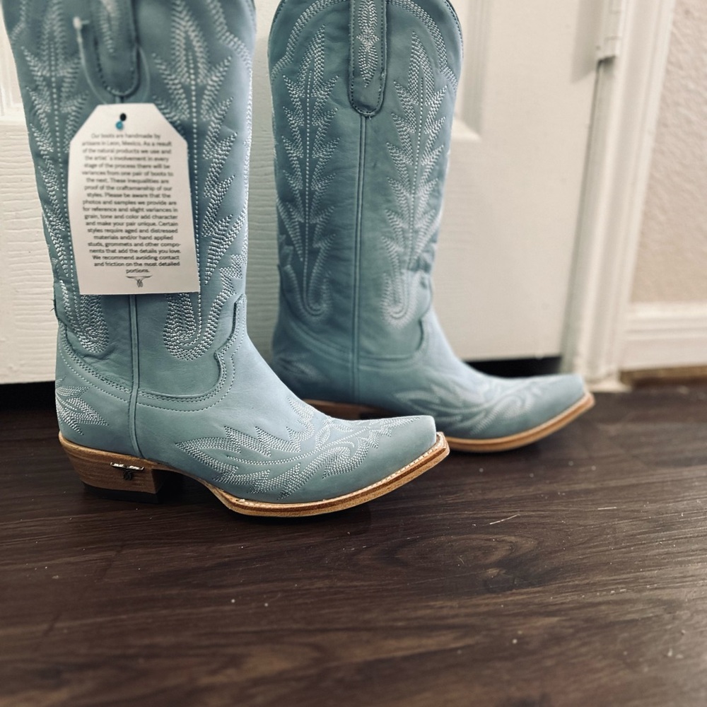 Blue and Brown Heeled Boots with Intricate Stitching